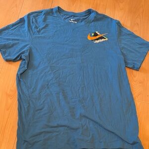 Nike Blue Short-Sleeve Tee with Orange Swoosh Graphic